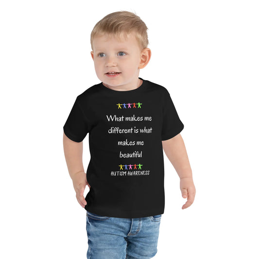 Child wearing a black t-shirt with autism awareness message on a white background