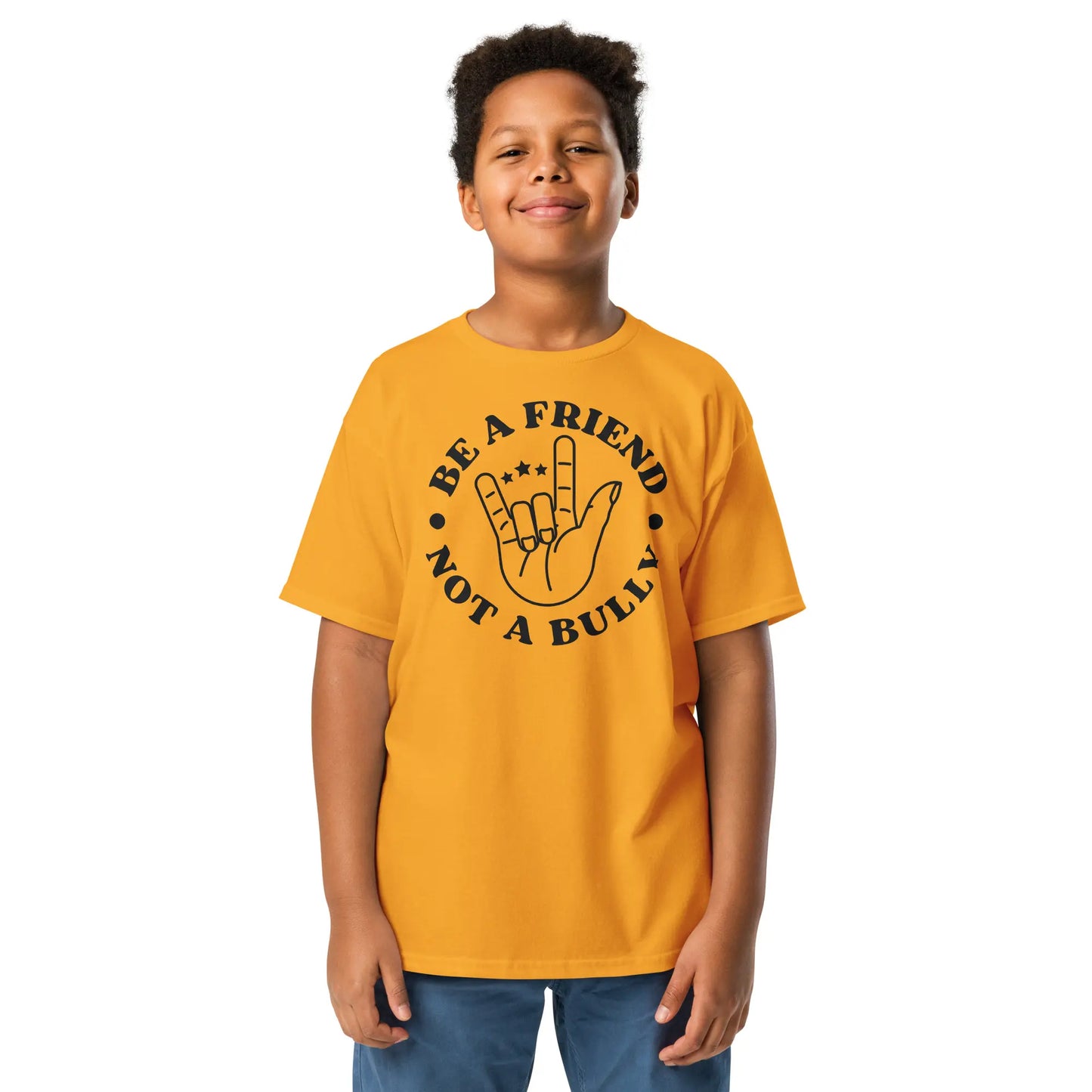 Child wearing a yellow t-shirt with 'Be a Friend Not a Bully' design on a white background