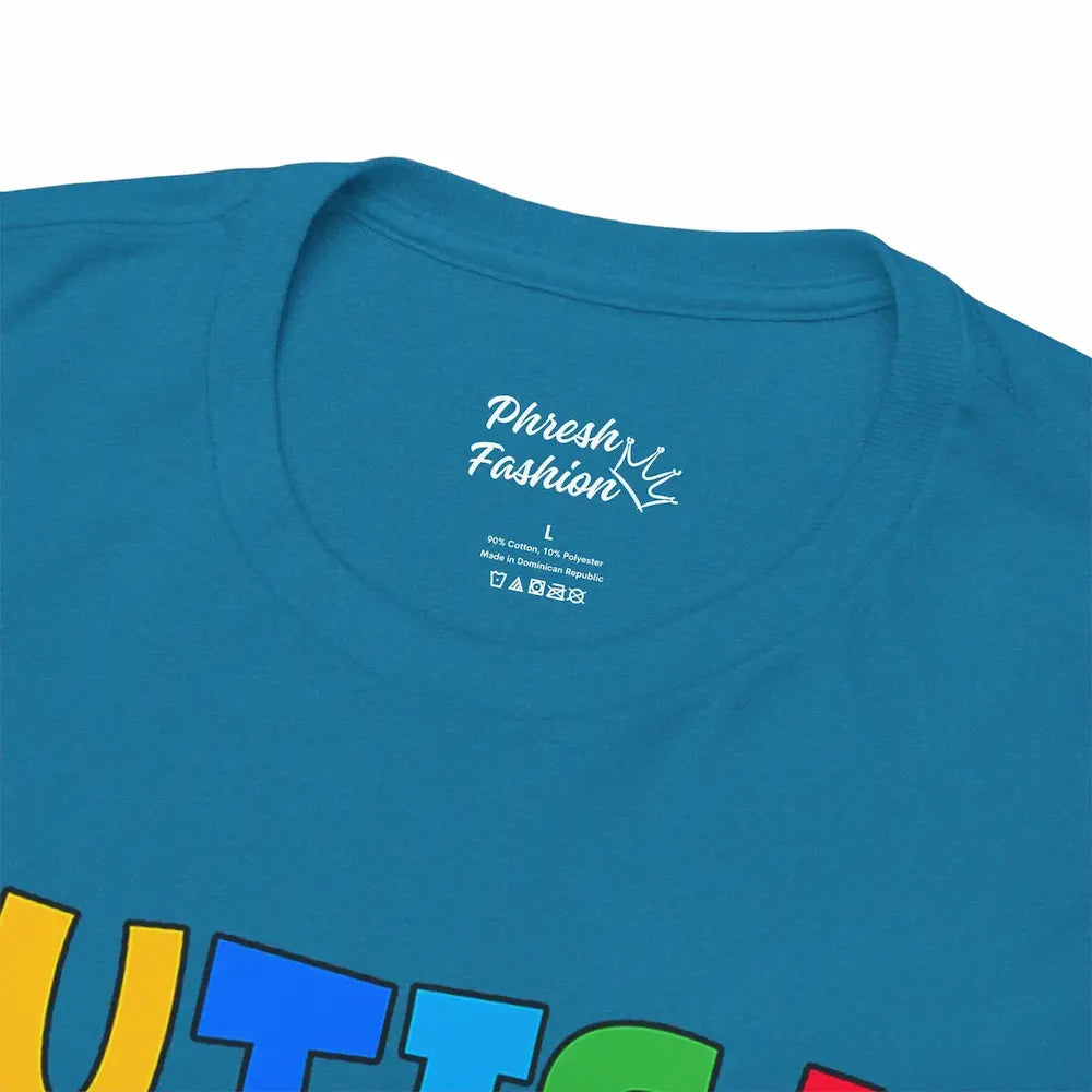 Close-up of a blue t-shirt with colorful text and 'Phresh Fashion' branding.